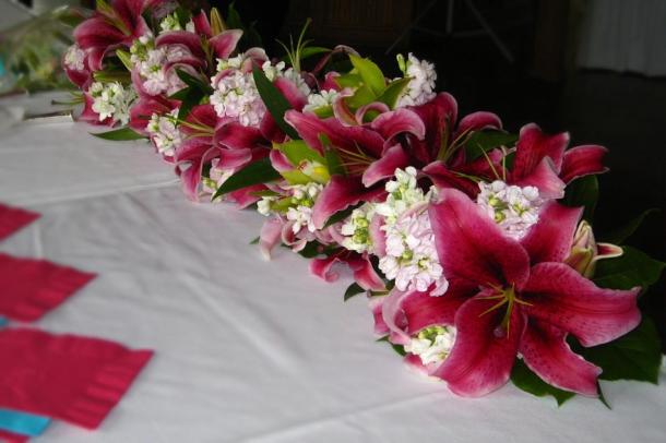 Bridal bouquet of pink stargazer lilies pink stock and green cymbidium 